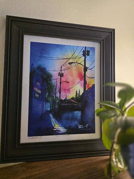 Signed watercolor print by artist Michael Bulloch displayed in a home.