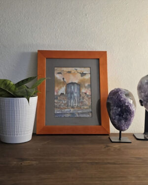 Waterfall Door watercolor painting displayed with amethyst crystals and houseplant