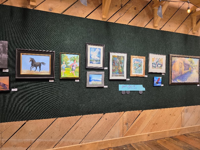 The "Just Move It" themed exhibit featuring colorful contemporary artwork by local artists.