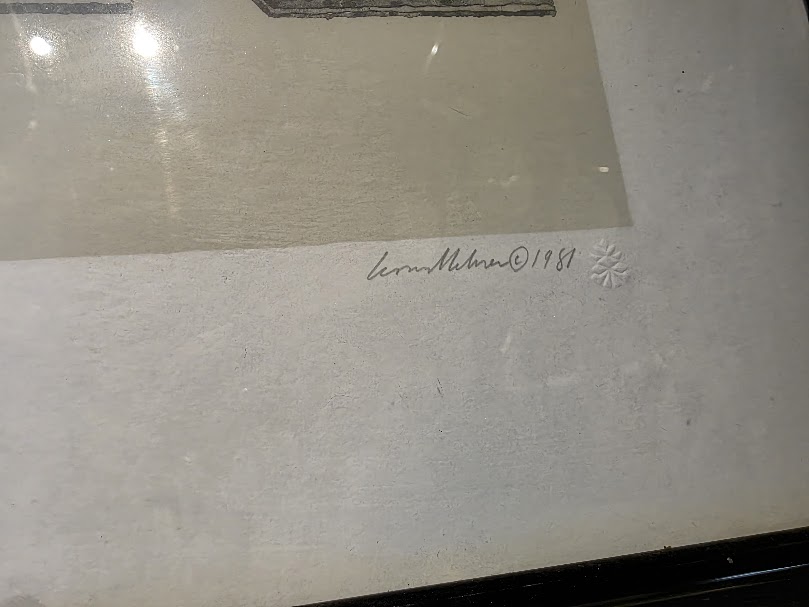 Close-up showing the title and signature on a framed thrift store print.