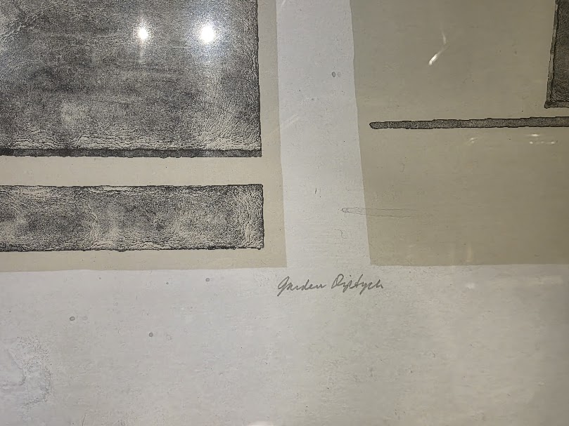Close-up showing the title and signature on a framed thrift store print.