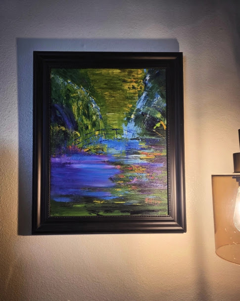 Original acrylic landscape painting in a black frame used to demonstrate how to identify original artwork.