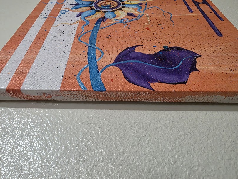 Close-up of the bottom edge of an original canvas painting showing painted sides and canvas texture.