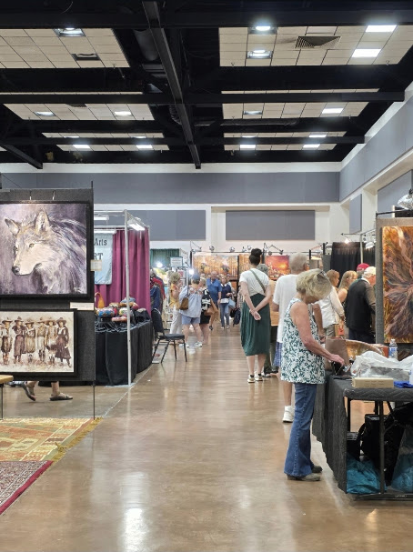 Booths featuring original paintings and handmade artwork at the Ruidoso Art & Wine Festival in New Mexico.