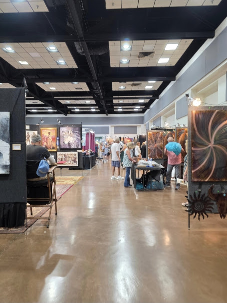 Artists and visitors browse original artwork inside the Ruidoso Art & Wine Festival at the Ruidoso Convention Center.