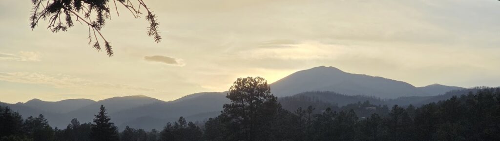 Mountain sunset overlooking the forests of Ruidoso, New Mexico during a weekend visit to the Ruidoso Art & Wine Festival.