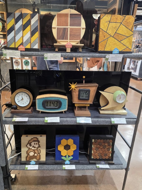 Handmade wooden clocks, wireless phone chargers, pixel art, and geometric woodworking at the Ruidoso Art Festival.